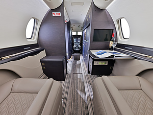 Cessna Citation Sovereign | Interior Shot of Two Pricate Seats One with a TV