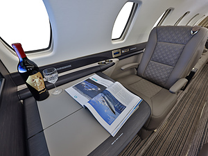 Cessna Citation Sovereign | Interior View of a Private Seat, Private Table and Wine with a Glass