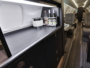 Cessna Citation Sovereign | Interior Shot of Full Bar and Three Bottles with Glasses 