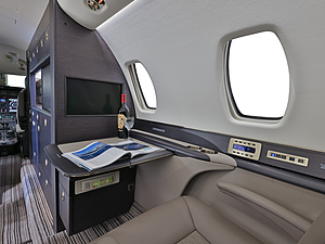 Cessna Citation Sovereign | Interior View of a Private Seat with Private TV and Table