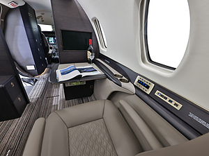 Cessna Citation Sovereign | Interior View of a Private Seat and Table with Magazine
